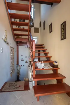 a staircase with wooden steps in a room at MARFAIA - Villa by the sea in Áyioi
