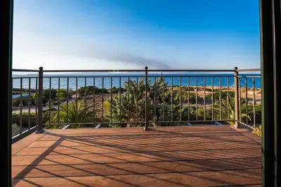 a balcony with a view of the ocean at MARFAIA - Villa by the sea in Áyioi