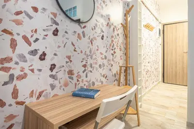 a dining room with a table and a mirror at Welcoming Koukaki Home by Cloudkeys in Athens