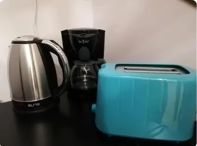 a coffee maker and a blender on a table at Heart of Athens Studio 25sqm in Athens