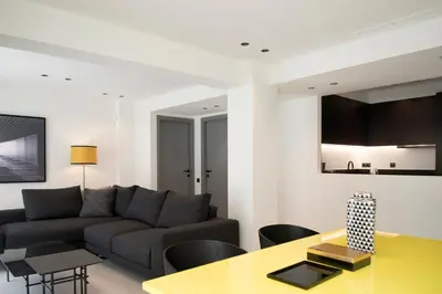 a living room with a couch and a table at Glyfada South42 in Athens