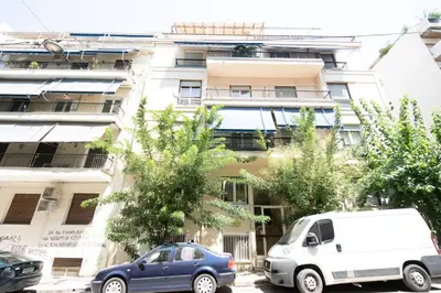 two cars parked in front of a building at Cute and Convenient Studio in Athens Center in Athens