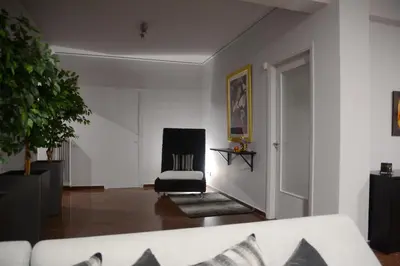 a living room with a couch and a chair at Modern & Classy Central Apartment in Athens