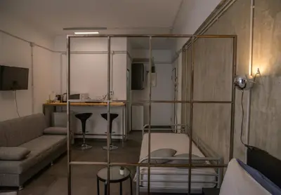 a living room with a couch and a table at Virginia's Boutique Apartments in Athens