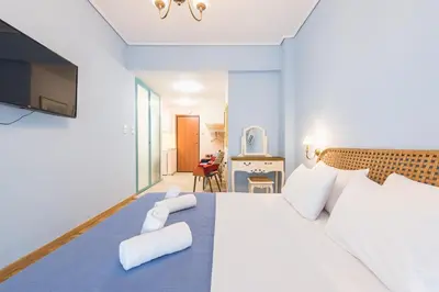 a bedroom with a large bed with two towels on it at Thissio Cocoon in Athens