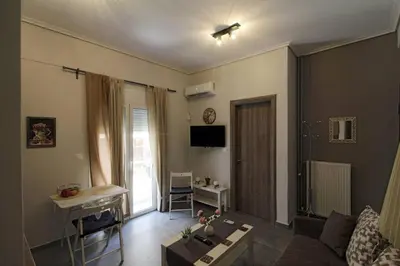 a living room with a couch and a table at Luxury flat in Hilton, central Athens, 3' metro, VFM! in Athens