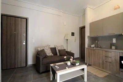 a living room with a couch and a table at Luxury flat in Hilton, central Athens, 3' metro, VFM! in Athens
