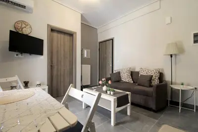 a living room with a couch and a table at Luxury flat in Hilton, central Athens, 3' metro, VFM! in Athens