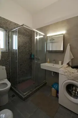 a bathroom with a shower and a toilet and a sink at Luxury flat in Hilton, central Athens, 3' metro, VFM! in Athens