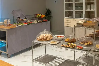 a buffet line with many different types of food at SUITES@SYNGROU-FIX in Athens