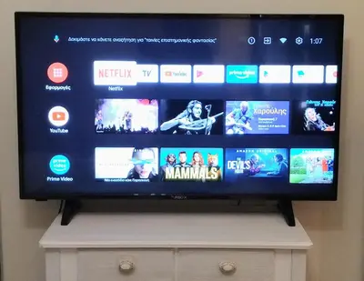 a flat screen tv sitting on top of a dresser at City Stay close to the National Museum in Athens