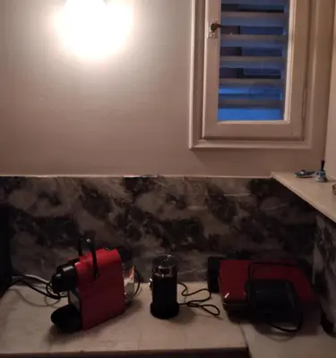 a counter with a camera and a light on top at Perikleous Apartment in Athens