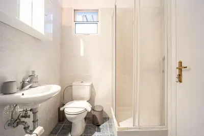 a bathroom with a toilet and a sink and a shower at GK Niki by GK Properties in Athens
