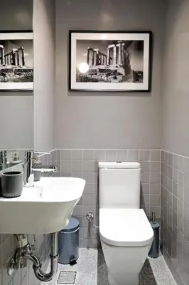 a bathroom with a white toilet and a sink at Art in Athens Suite in Athens