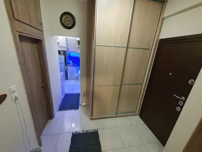 a hallway with a walk in shower and a door at Cozy Little Home in Athens