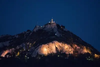 a castle on top of a mountain at night at Athens Terrace 360° in Athens