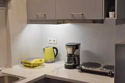 a kitchen with a yellow blender on a counter at Check Point - Acropolis in Athens
