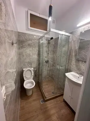a bathroom with a shower and a toilet and a sink at Check Point - Acropolis in Athens