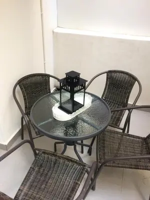 a glass table with chairs and a candle on it at Check Point - Acropolis in Athens