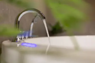 a stream of water coming out of a sink at NOHO Boutique , premium living Dikeou 8 in Athens