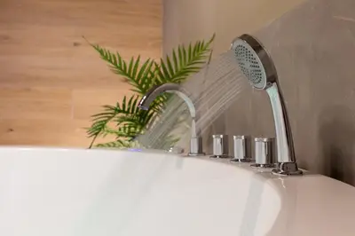 a bathroom sink with a water faucet at NOHO Boutique , premium living Dikeou 8 in Athens
