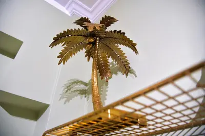 a palm tree sitting on top of a staircase at Your Attiki Home VIPGreece in Athens