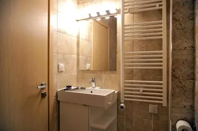 a bathroom with a sink and a mirror at Your Attiki Home VIPGreece in Athens