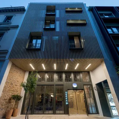 a building with the front entrance of a building at Fos DownTown Suites in Athens