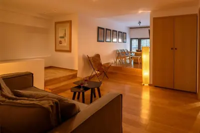 a living room with a couch and a table at Fos DownTown Suites in Athens