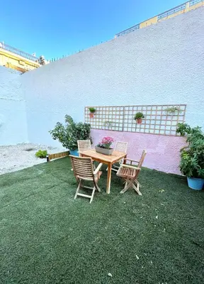 a table and two chairs and a table and a table and chairs at Bohem Apartment near Athens Airport in Spáta