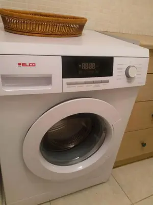 a washing machine with a basket on top of it at Art apartment Syngrou in Athens