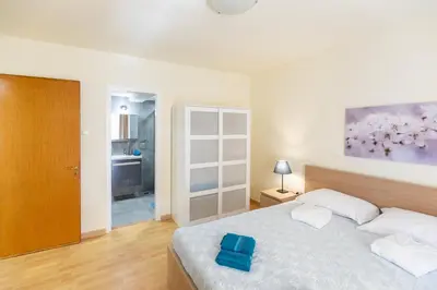 a bedroom with a bed with a blue box on it at Athens Kyniska Urban Apartment in Athens