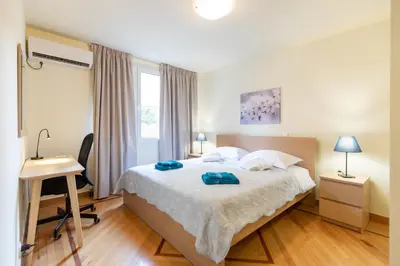 a bedroom with a bed with two towels on it at Athens Kyniska Urban Apartment in Athens