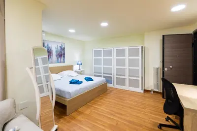 a bedroom with a bed and a ladder in it at Athens Kyniska Studio in Athens