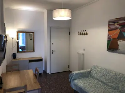 a living room with a couch and a table at Metaxourgio spacious two bedroom apartment in Athens