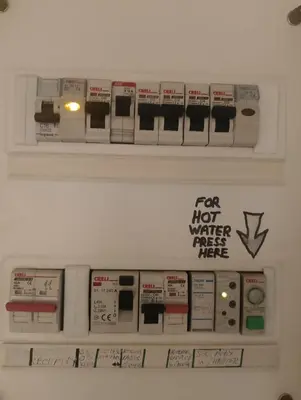 a sign on a wall that says for hot water preset rate at Metaxourgio spacious two bedroom apartment in Athens