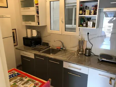 a kitchen with a sink and a counter top at Metaxourgio spacious two bedroom apartment in Athens