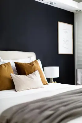 a bedroom with a bed with brown and white pillows at Modern 1BD Apartment close to the Acropolis Museum by UPSTREET in Athens