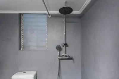 a bathroom with a shower with a toilet and a window at Cozy, Central, Safe Double rooms in apartment, close to Acropolis in Athens