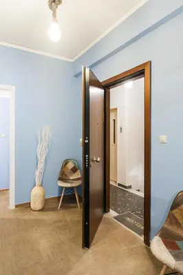an open door in a room with blue walls at Cozy, Central, Safe Double rooms in apartment, close to Acropolis in Athens