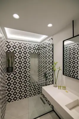 a bathroom with a white sink and a mirror at Ederlezi Zoubourlou Aparthotel in Athens