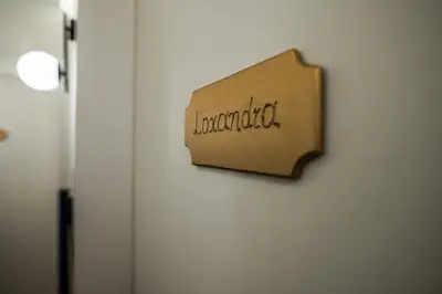 a sign on a door with the word lombardy at Ederlezi Zoubourlou Aparthotel in Athens