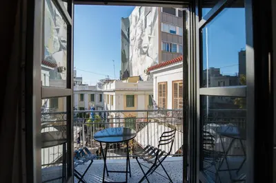 a view of a balcony with a table and chairs at Ederlezi Zoubourlou Aparthotel in Athens