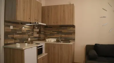 a kitchen with a sink and a stove top oven at The Victoria Square Exceptional Apartments in Athens