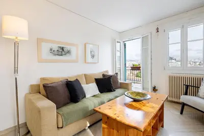 a living room with a couch and a table at In the shadow of Acropolis in Athens