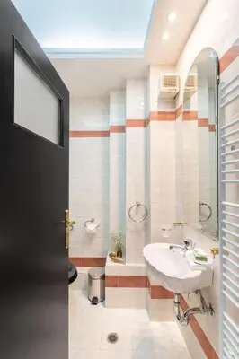 a bathroom with a sink and a shower at Fresh Detailed Stylish Apartment at Acropolis in Athens