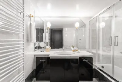 a white bathroom with a sink and a shower at Fresh Detailed Stylish Apartment at Acropolis in Athens