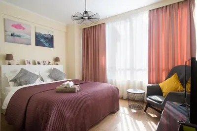 a bedroom with a bed with a stuffed animal on it at Syntegma studio next to Ermou street in Athens