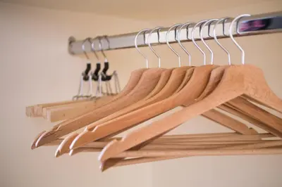 a bunch of wooden utensils hanging on a rack at Syntegma studio next to Ermou street in Athens