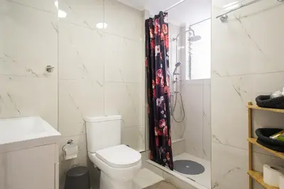 a bathroom with a toilet and a shower at Syntegma studio next to Ermou street in Athens